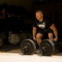 Strongman Eric Todd performing farmers carry