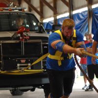 ASC Pro Strongman Spenser Remick doing truck pull at the 2015 USA Classic