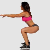 Martial artist Jennifer Dietrick performing an air squat