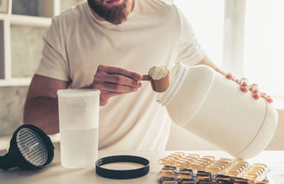 male mixing a protein shake