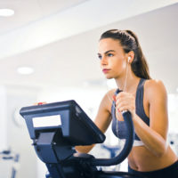 Woman on an elliptical / myHMB blog How to Keep Cardio Fun
