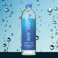 Bottled water product Nirvana HMB featuring the muscle health ingredient myHMB and water droplets in the background