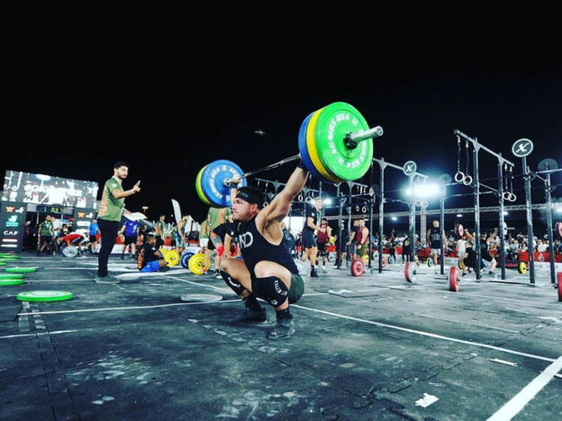 team myHMB athlete and CrossFit athlete Rob Schillaci competing and performing a squat snatch