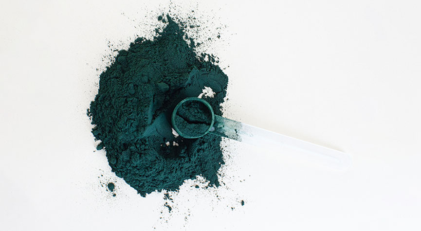 green powder with a powder scoop / myHMB news article How to Become a Major Player in the Supplement Market